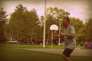 man running with dixie cups